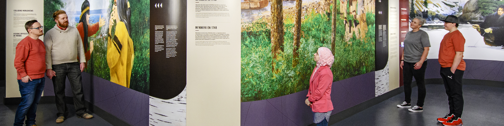 Visitors exploring the Mi'kma'ki gallery at Fortress Halifax: A City Shaped by Conflict exhibit at the Halifax Citadel National Historic Site, 2021