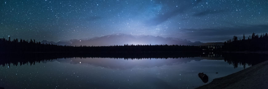 A night sky over lake