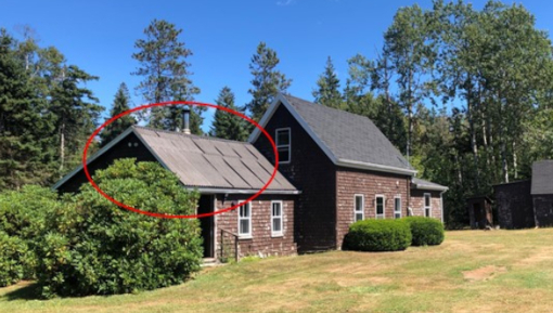 A small building with a red circle drawn around the upper part.