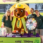Parks Canada lovable mascot Parka standing alongside the Learn-to Camp team.