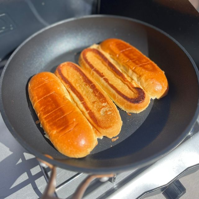 Buns toasting lightly in a dry pan.