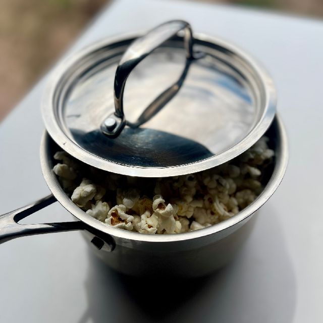 A lid placed on the pot so the remaining kernels can pop.
