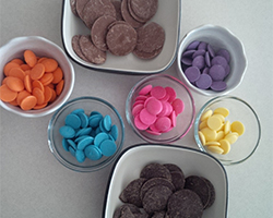 Bowls filled with chocolate pastilles