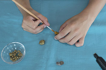 Painting little rocks in gold colour