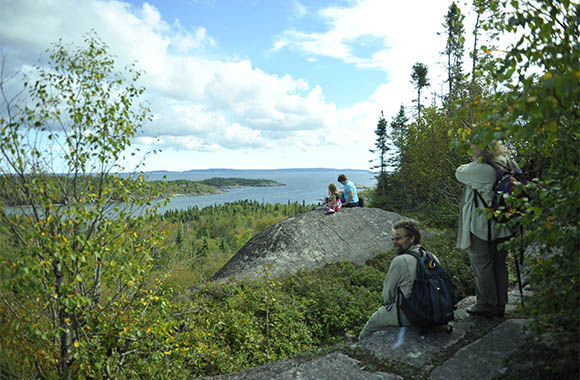 Visitors hike at  Lake Superior National Marine Conservation Area
