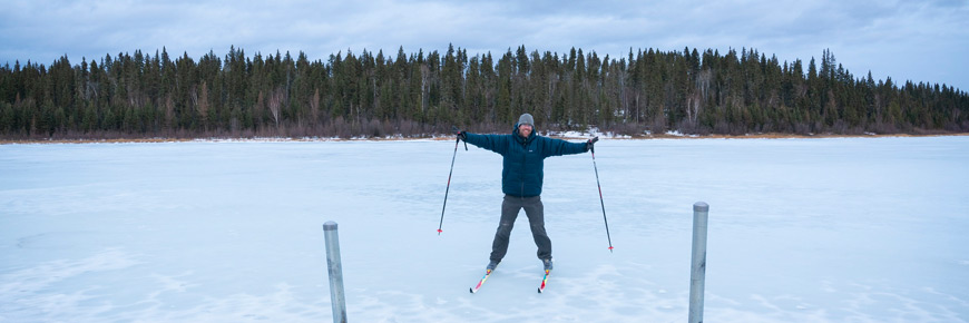 A visitor skis on Pine Lake.