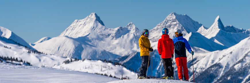 Three men ski in Sunshine Village.