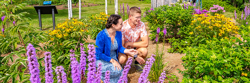 Two persons in an ornamental garden at Alexander Graham Bell National Historic Site