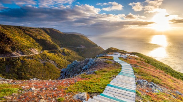  A view of the sun setting over the Atlantic ocean from the top of the Skyline Trail in Cape Breton Highlands National Park National Park.