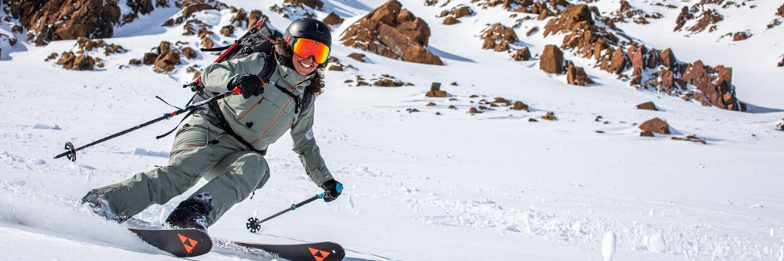 An off-trail skier going down a mountain in Gros Morne National Park.