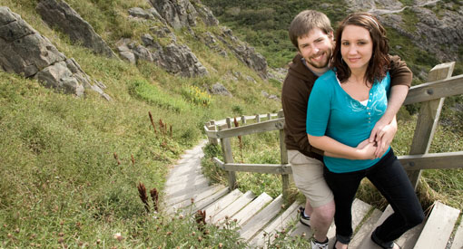 Two visitors on the stairs of the North Cape Trail.