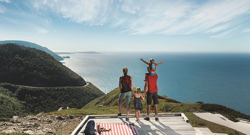 A family observes the sea from a lookout on the Skyline Trail.