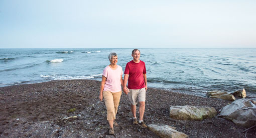 A couple enjoys a stroll near the water at the southern most point on Canada's mainland.