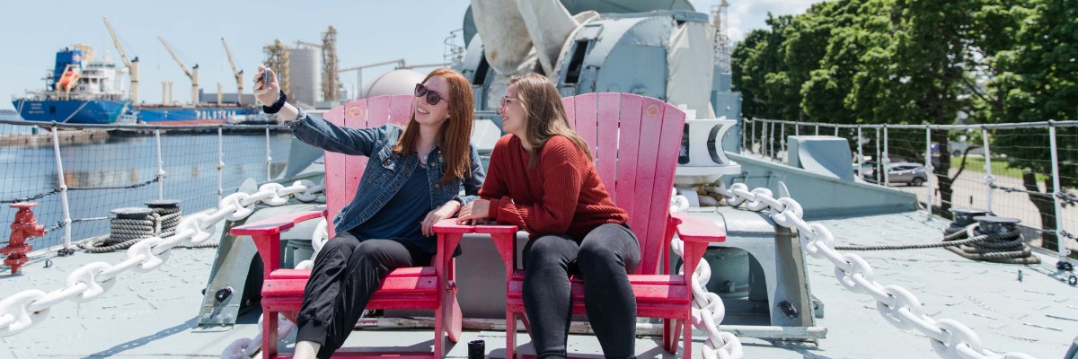 Visitors have a picnic by the HMCS Haida ship