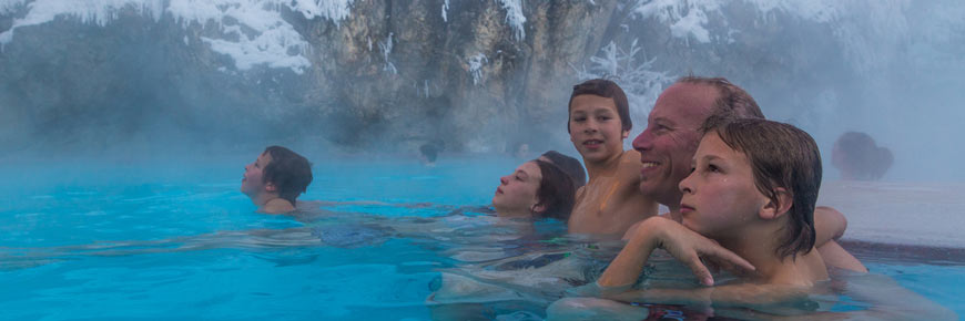 A family having fun in the radium hot springs.
