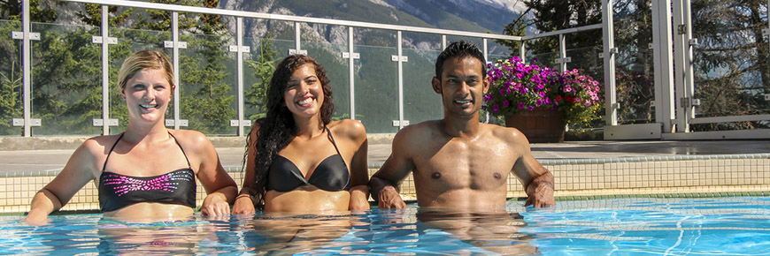 Three adults in the hot pool at Banff Upper Hot Springs
