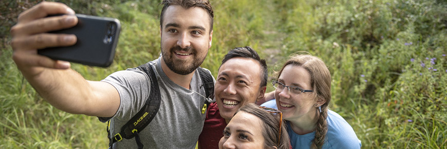 Visitors capture a selfie on Beaver Pond Trail
