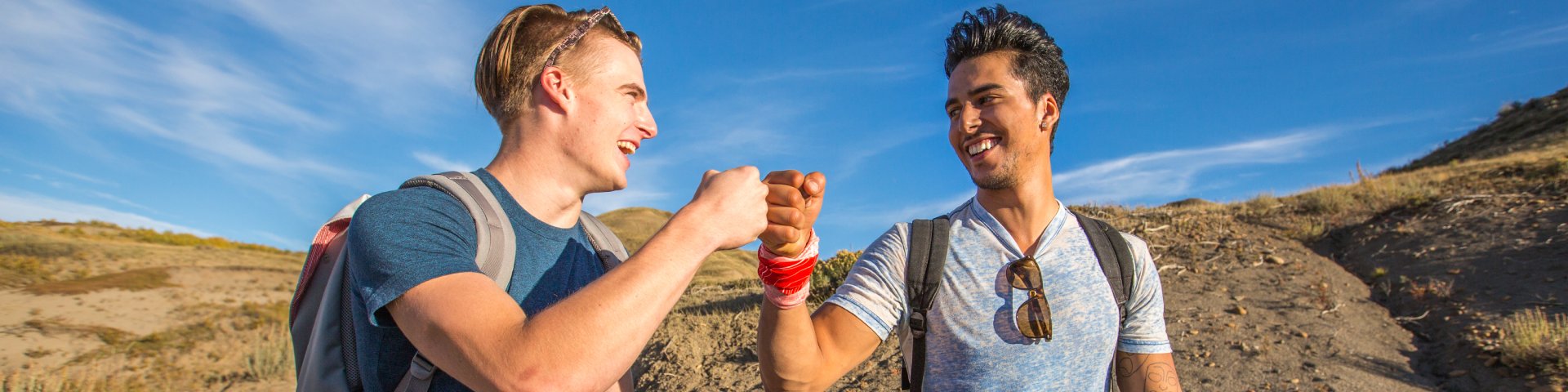 Two young adults hiking on the 70 Mile Butte Trail in the West Block of Grasslands National Park.