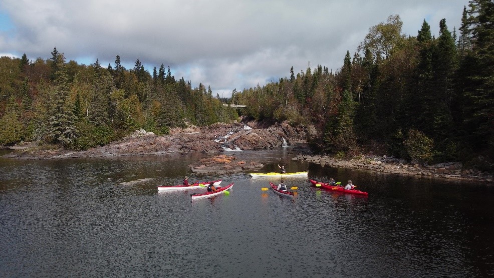 A group of people in kayaks.