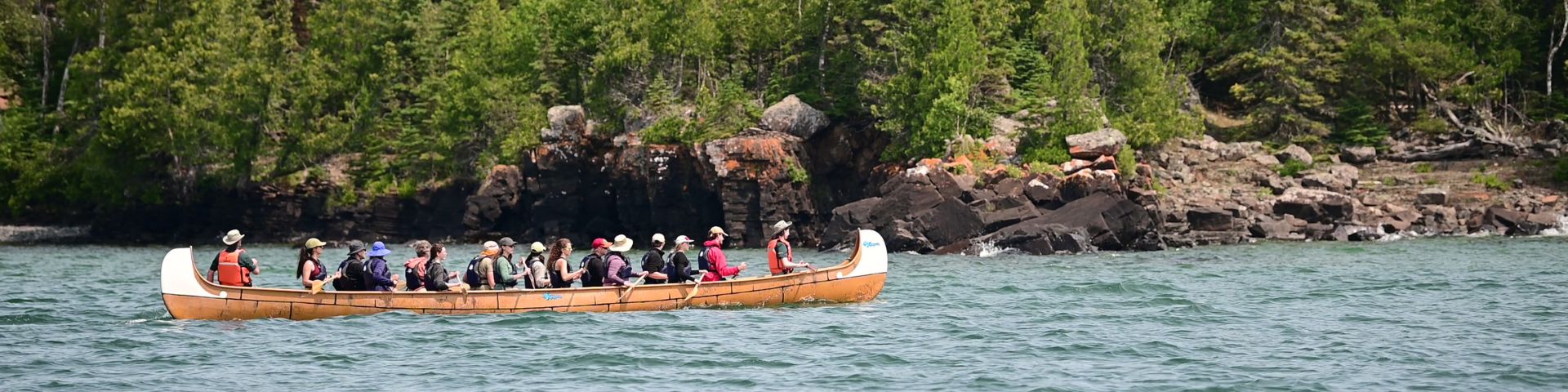 A group taking a tour on a large boat.