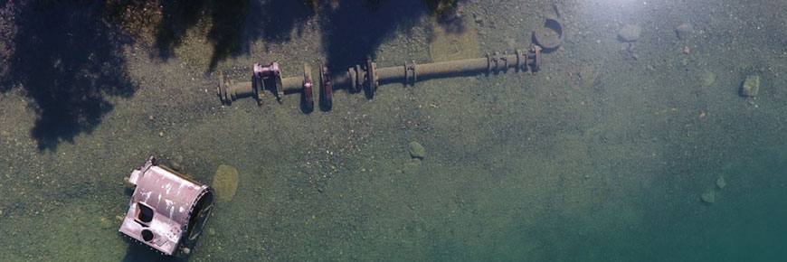 Aerial photo of the boiler from a shipwreck in the water off Battle Island