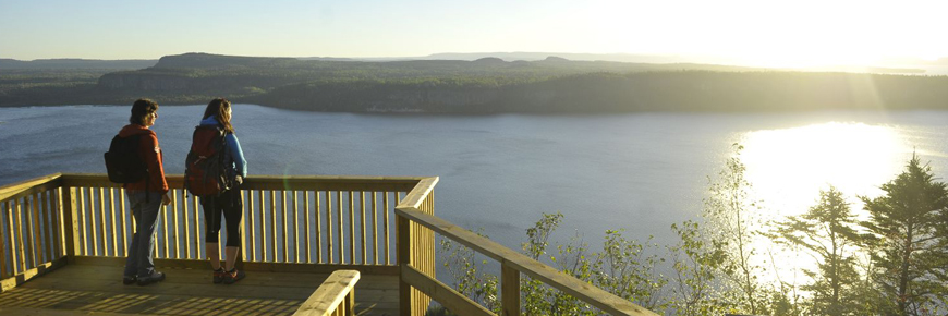 Two people looking at Lake Superior.