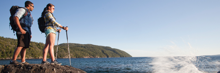 Two people on the shore of Lake Superior