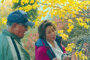 Two Inuvialuit Elders by a tree
