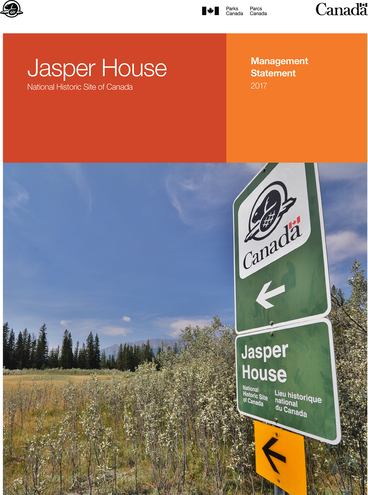 A sign that says Jasper House. Two orange rectangles. Written in white text are the words Jasper House National Historic Site of Canada Management Statement 2017