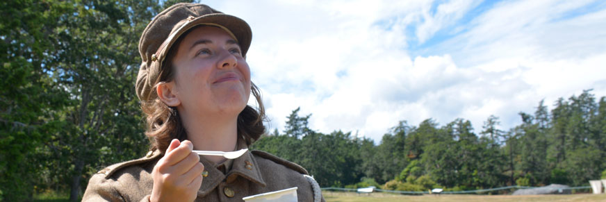 A Parks Canada interpreter enjoys a cup of specially crafted ice cream resulting in a huge smile.