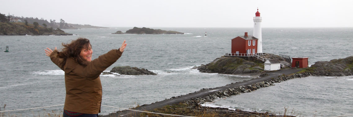 A person at the top of Lower Battery stretches their arms to catch the winds.