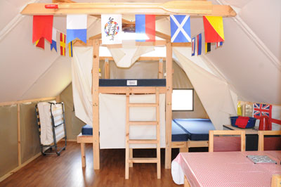 Inside oTENTik #1 showing the bunkbed setting and cot.