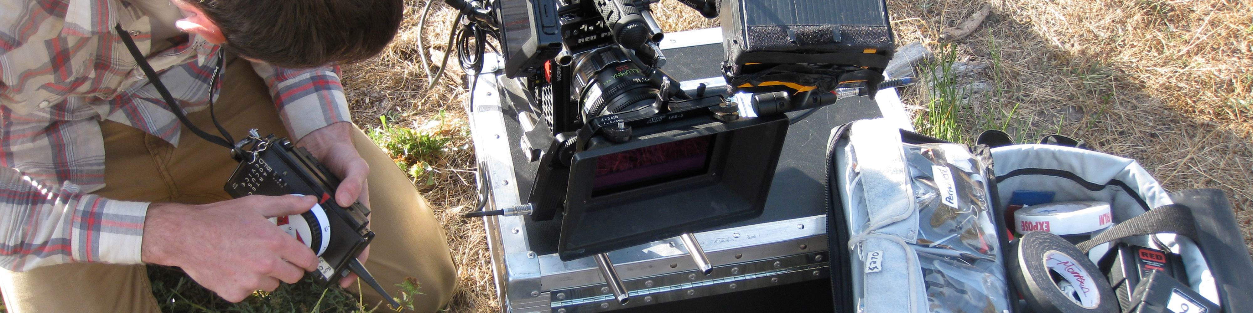 View from above of camera equipment and a person working with a remote zoom.