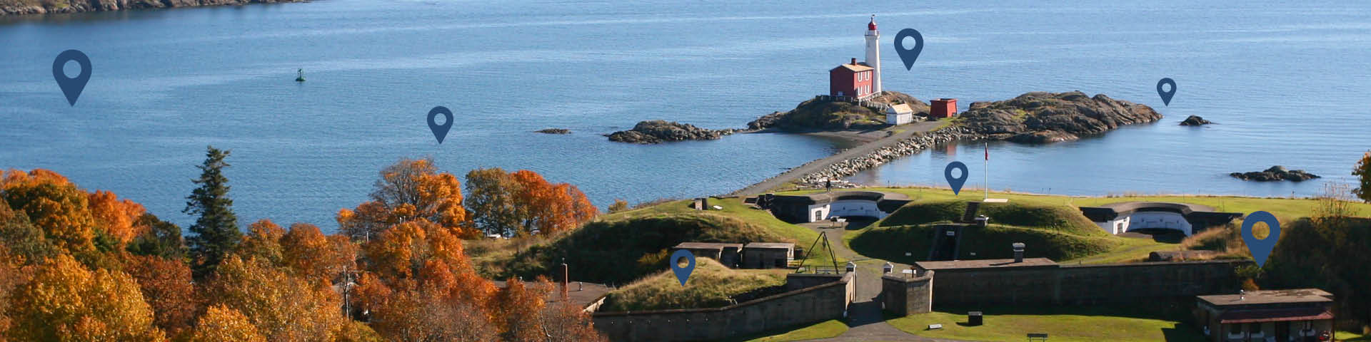 Aeriel shot of a battery and a lighthouse with locator pins.