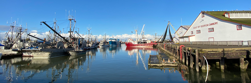 The Gulf of Georgia Cannery and fishing boats in Steveston harbour.