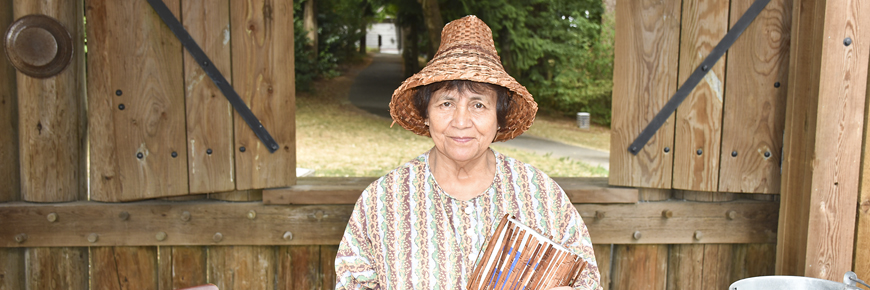 A Kwantlen First Nation elder wearing a traditional cedar hat she wove.