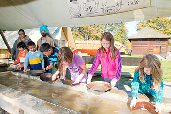 Children pan for gold at Fort Langley