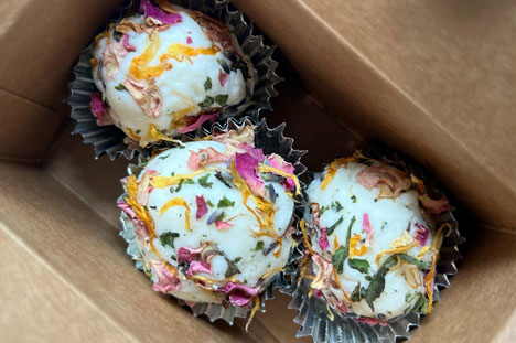 White bath bombs covered in dried flower petals.