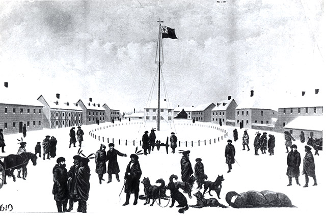 A black-and-white image of people, horses and dogs inside a fort with several buildings around them.