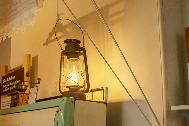 An illuminated lantern sits atop a ledge at St. Andrew’s Rectory.