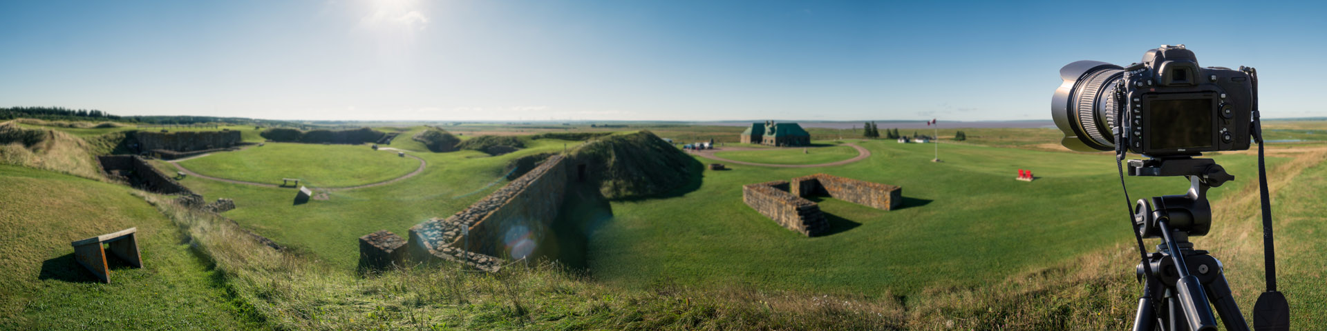 A camera on a tripod, set up to take a photograph of the Fort.