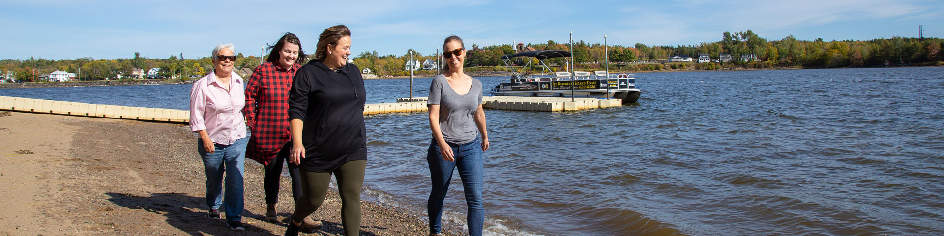 Visitors walking on the beach on the island.