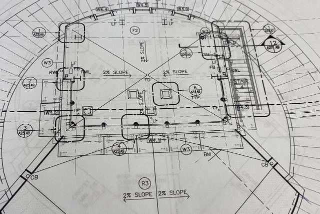 Designs for the command post's sloped roof which channels water off the structure to prevent infiltration.