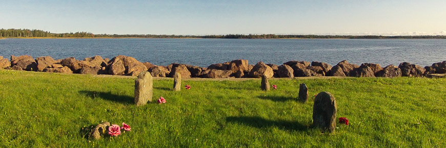 An old cementary in a field next to the sea