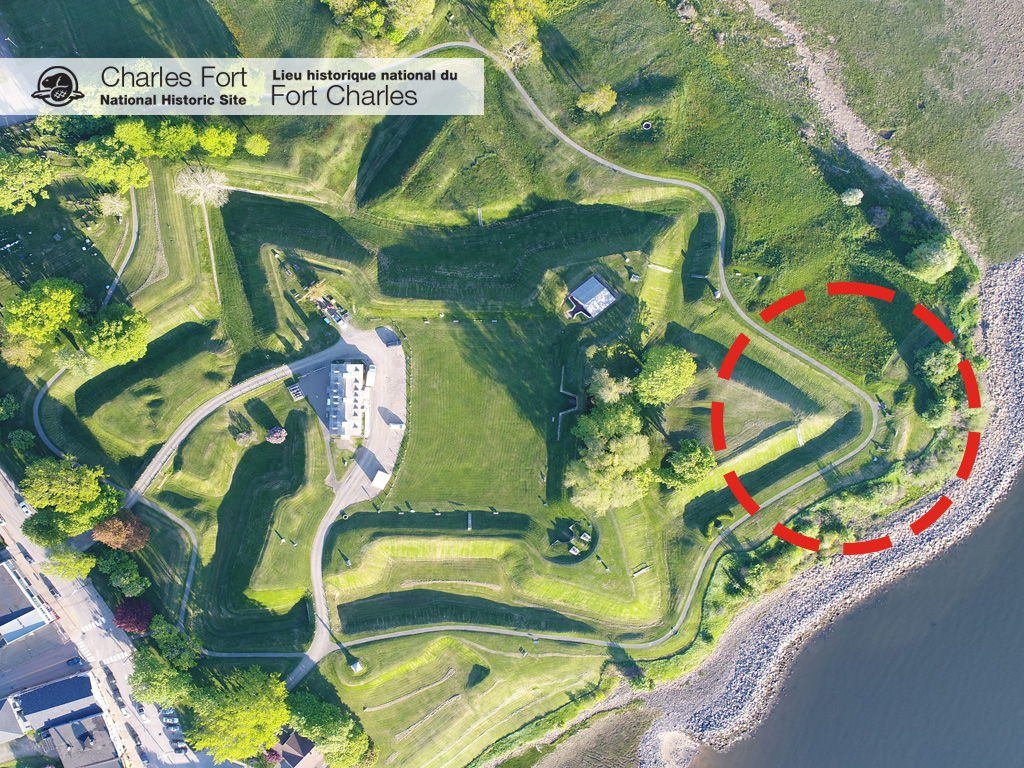 An aerial view of Fort Anne National Historic Site with a circle indicating the location of Charles Fort at the edge of the fort next to the Annapolis River.