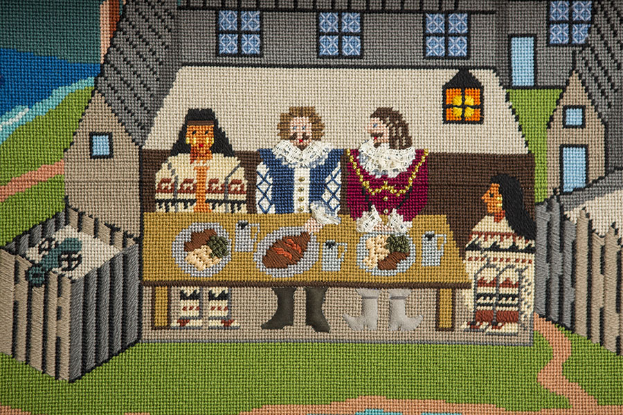 Three people sharing a meal together at the Habitation.