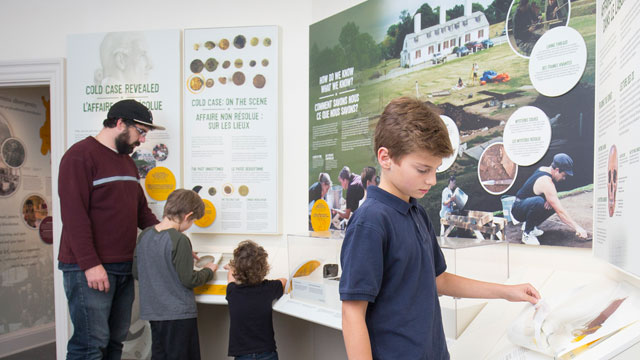 A family exploring interactive exhibits.