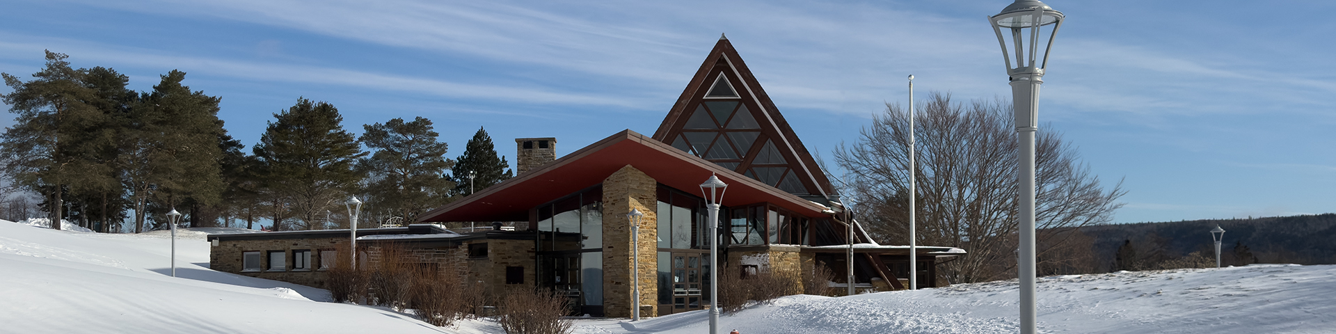 A snowy winter day looking at the outside of the Alexander Graham Bell National Historic Site.