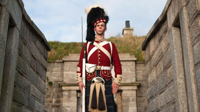 A Highlander standing guard with a bayonet.