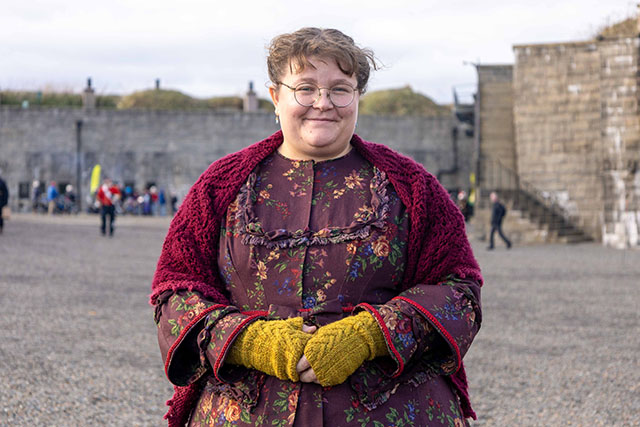 A soldier's wife in a flowered dress.